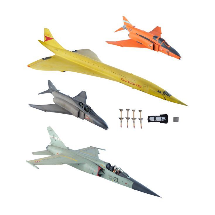 79. Concorde Model Miniature with Three Fighter Jet Model Miniatures