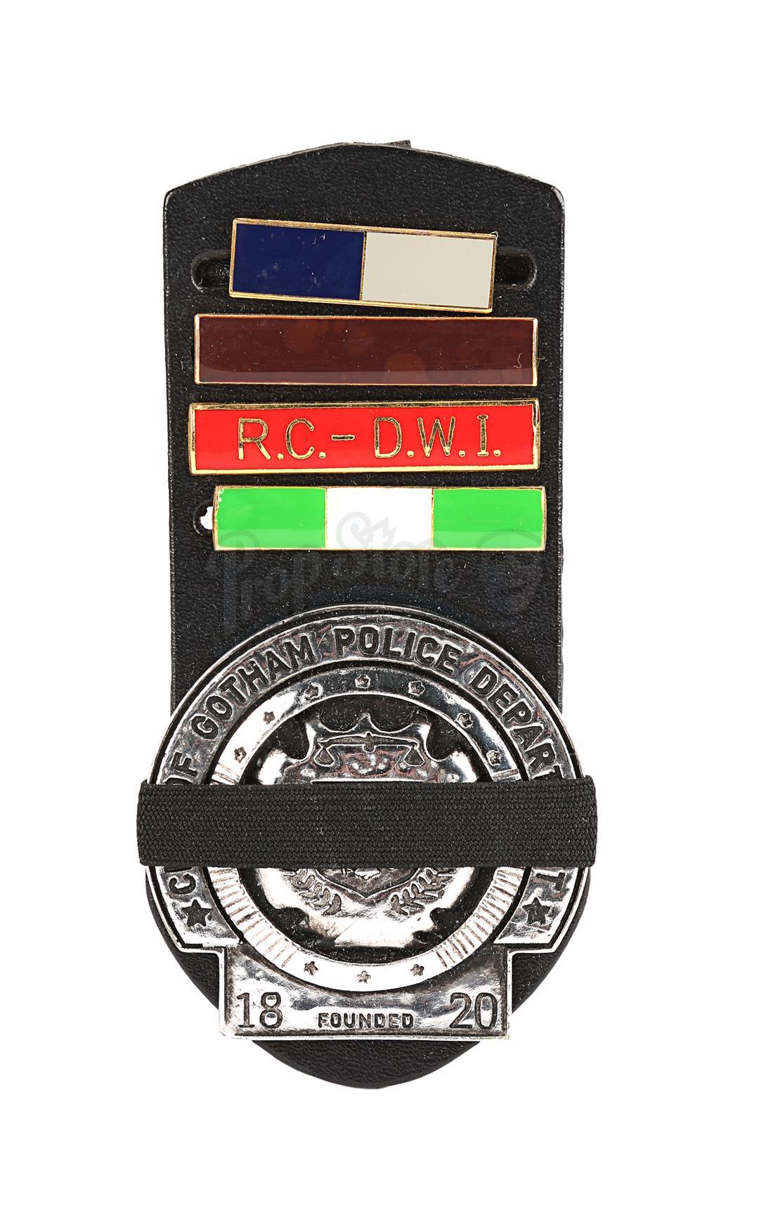 Lot #101 - THE DARK KNIGHT (2008) - Gotham City Police Badge with Mourning  Band and Ranking Bars, image size:1080x1726