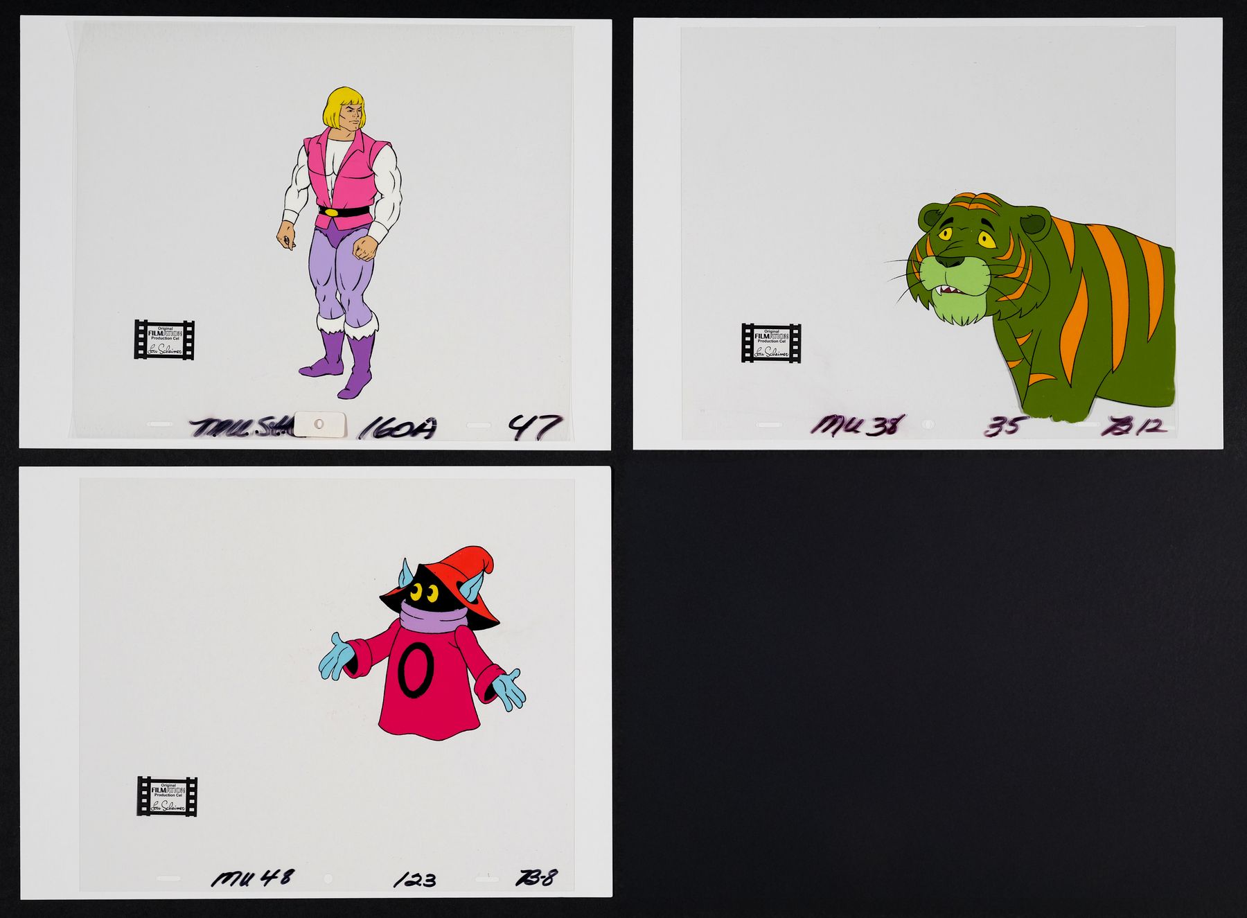 2037. Prince Adam, Orko and Cringer Original Production Cels ### HE-MAN ...